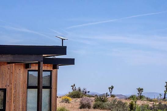 Starlink dish on the roof of a remote house